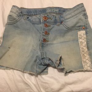 jean shorts with white flowery lace